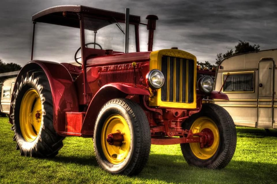 Farm tractor parked on grass