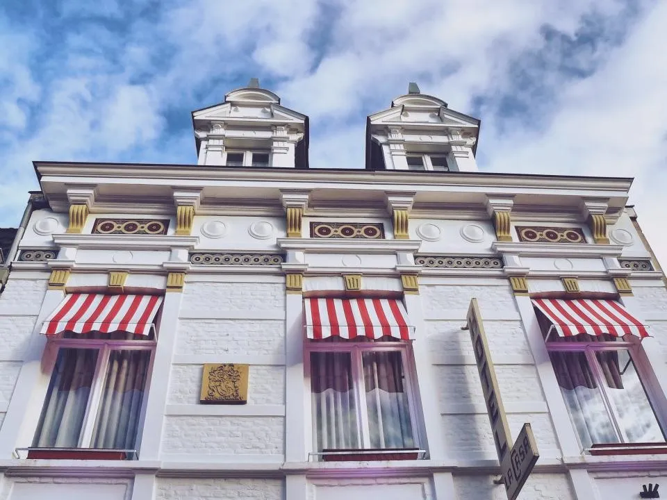 Hotel facade with striped awnings