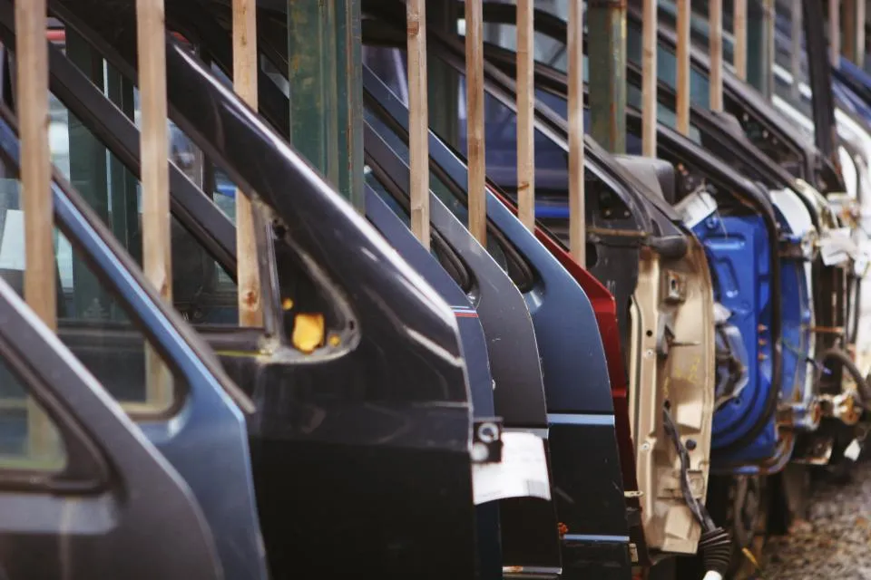 Vehicle door panels moving along a manufacturing line