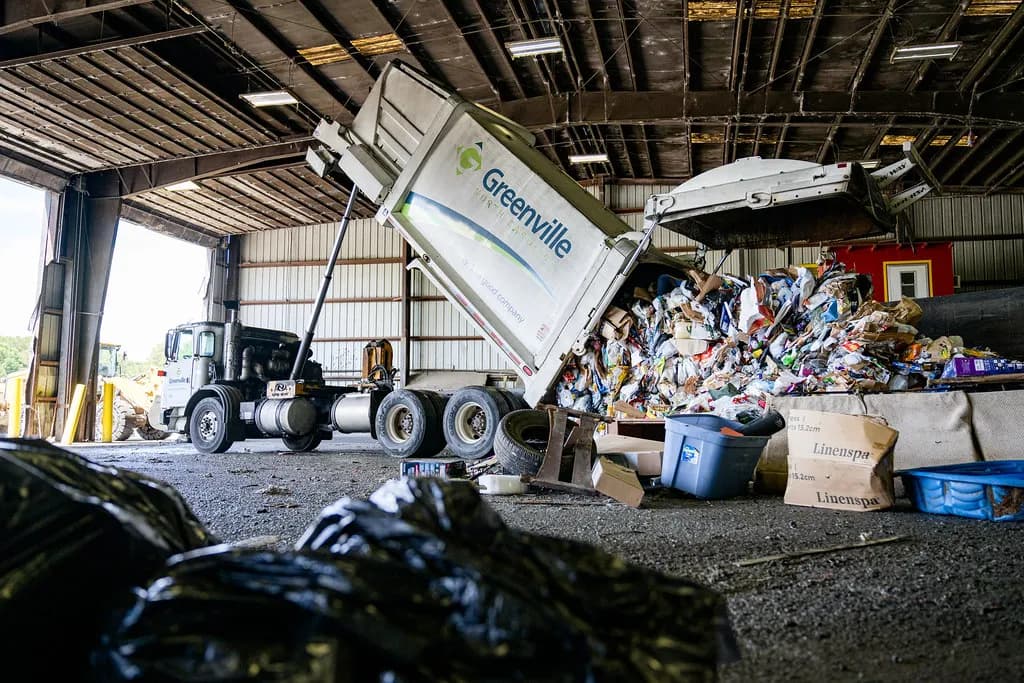 Collection truck unloading at a transfer station