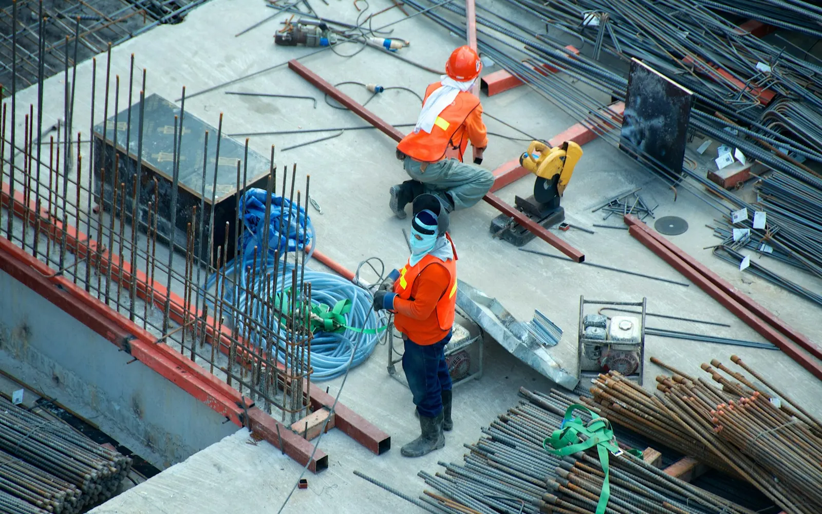 Active construction site with steel and concrete work